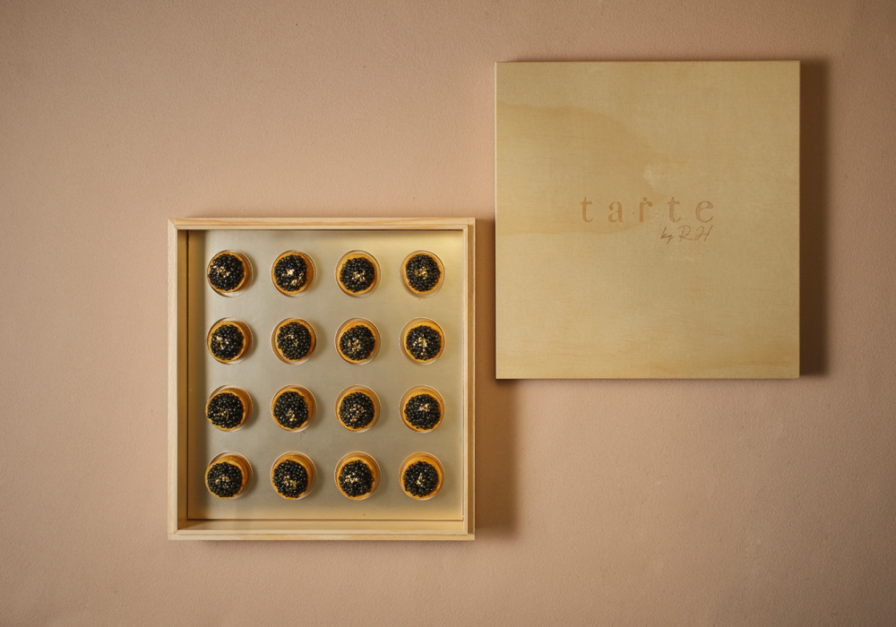 sharing bite-size signature caviar tarts